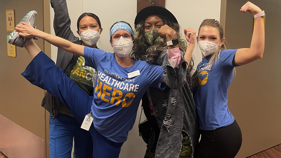 Cheerful Gigi and healthcare providers at Texas oncology center 