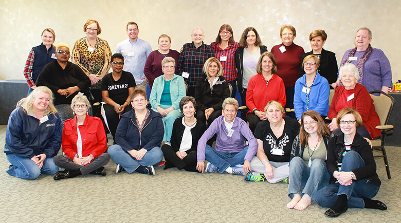 Woman join together for a group photo during a weekend trip full of hope 